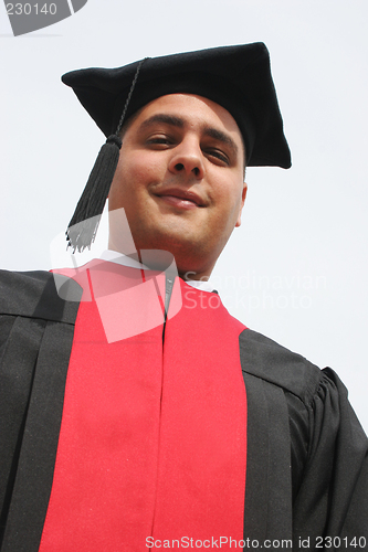 Image of Attractive man in gowns on university graduation day