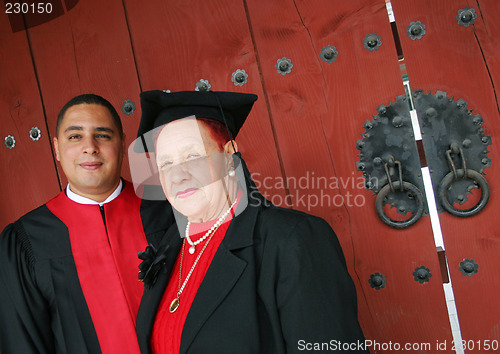 Image of University graduate in robes with his grandmother