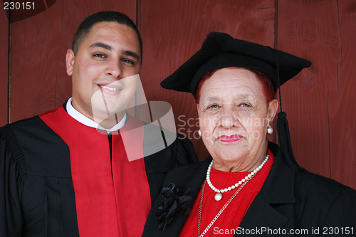 Image of University graduate in robes with his grandmother.