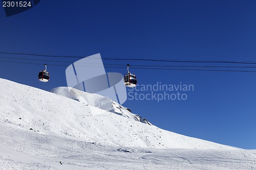 Image of Gondola lift and ski slope