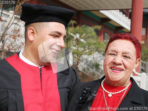 Image of Happy graduate shares a moment with his grandmother