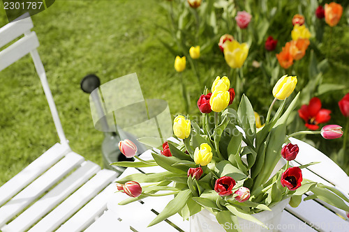 Image of bouquet of tulips on a garden table