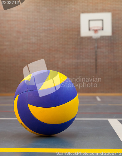 Image of Blue and yellow ball on blue court at break time