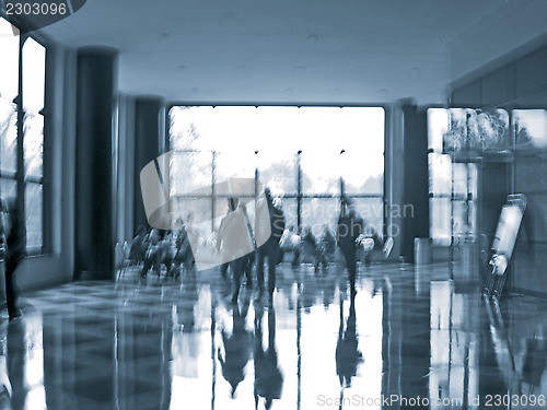 Image of business people activity in the office lobby motion blur