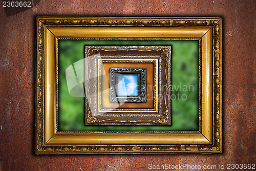 Image of abstract view with frames on rusty industrial wall