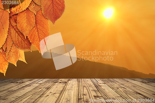 Image of autumn backdrop with wooden terrace