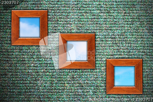 Image of grungy wall with three wooden frames