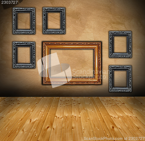 Image of wall with composition of empty frames