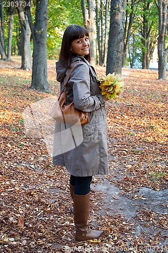 Image of woman in autumn park 