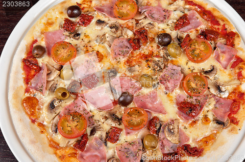 Image of pizza with ham and mushrooms