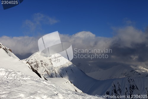 Image of Winter mountains and blue sky with clouds