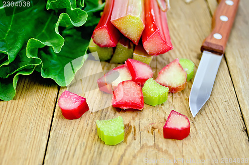 Image of Rhubarb cut with a knife on a board