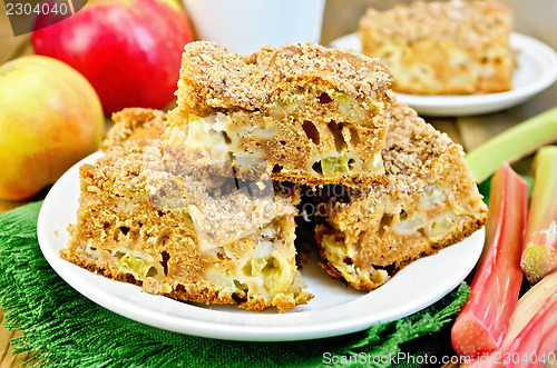 Image of Pie with rhubarb and apples on a green napkin