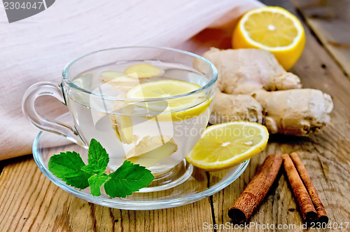 Image of Tea ginger with lemon and cinnamon on board
