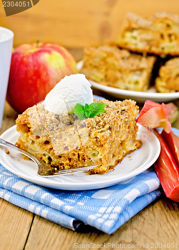 Image of Pie with rhubarb  and ice cream on the board