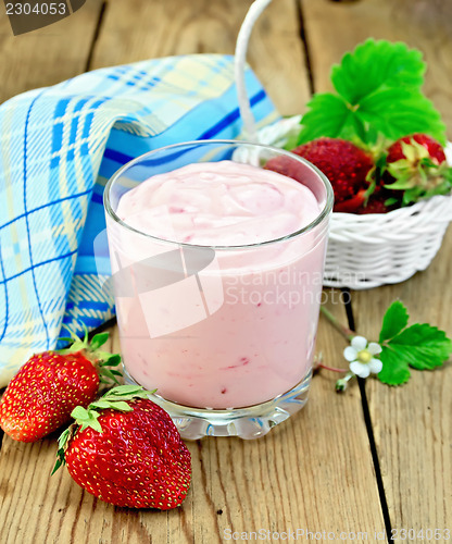 Image of Milkshake with strawberries in a white basket