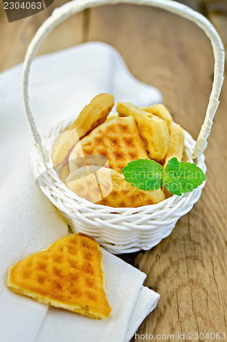 Image of Biscuit in the shape of hearts in a white basket with mint