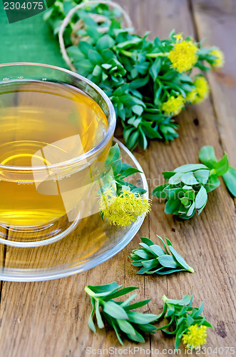 Image of Herbal tea with Rhodiola rosea in the cup on the board