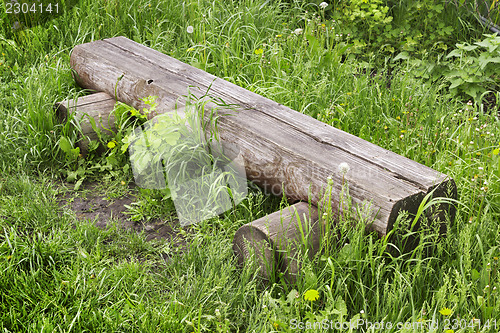 Image of Bench made in log in village street