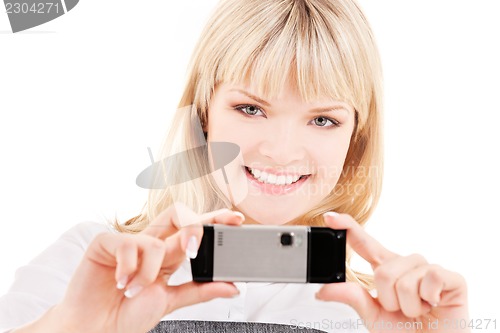 Image of happy woman using phone camera