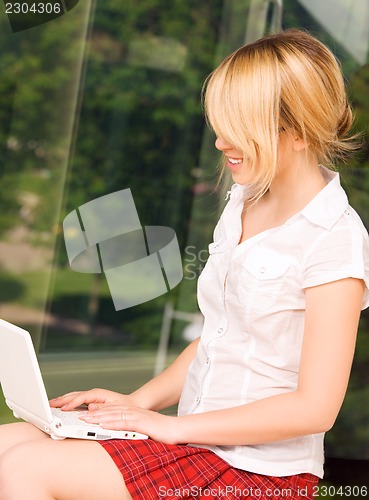 Image of office girl with laptop computer