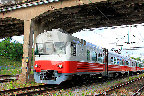 Image of Commuter Train Under Bridge