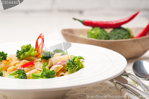 Image of Italian penne pasta with broccoli and chili pepper