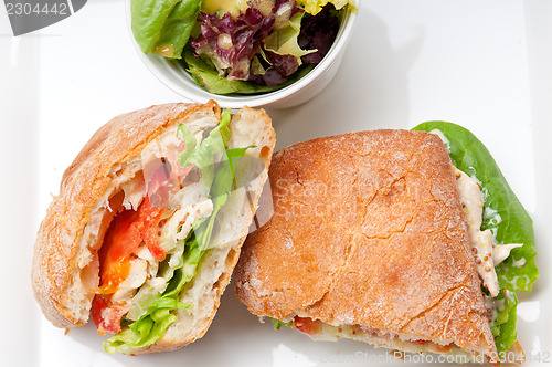 Image of ciabatta panini sandwich with chicken and tomato