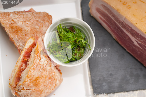 Image of ciabatta panini sandwich with parma ham and tomato