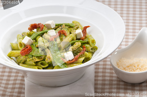 Image of Italian penne pasta with sundried tomato and basil