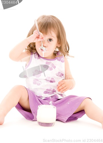 Image of little girl with yogurt