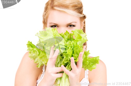 Image of happy woman with lettuce