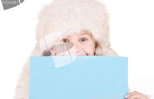 Image of girl in winter hat with blank board