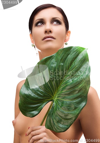 Image of woman with green leaf