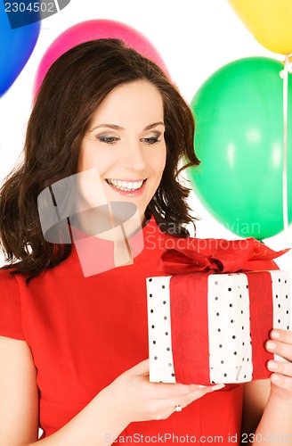 Image of woman with gift box and balloons