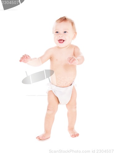 Image of standing baby boy in diaper