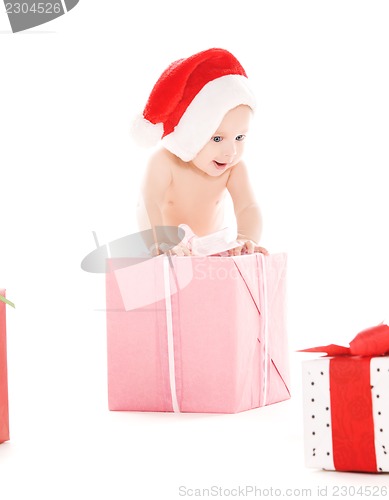 Image of santa helper baby with christmas gifts