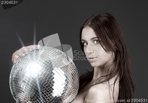 Image of beautiful naked woman with disco ball