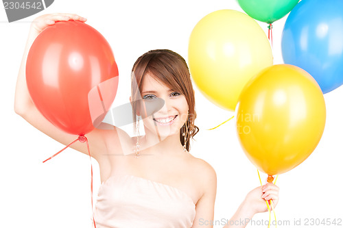 Image of happy teenage girl with balloons