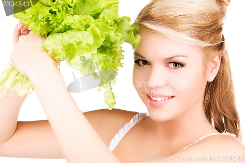 Image of happy woman with lettuce