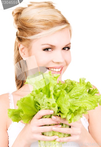 Image of happy woman with lettuce
