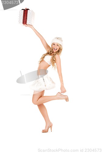 Image of cheerful santa helper girl with gift box