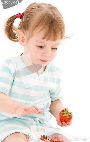 Image of little girl with strawberry