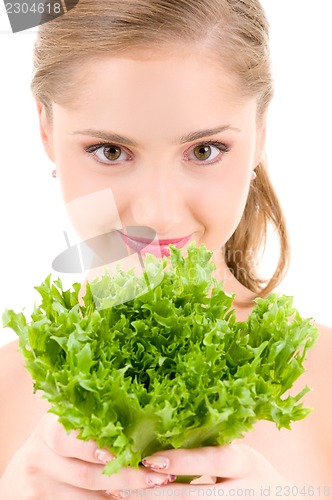 Image of happy woman with lettuce