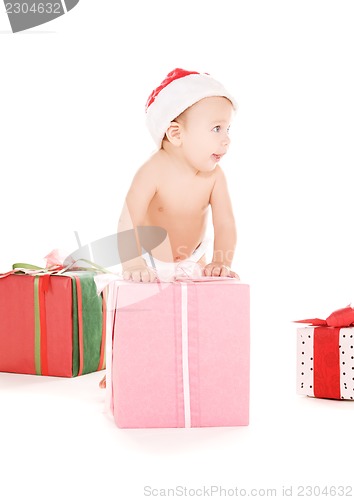 Image of santa helper baby with christmas gifts