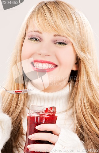 Image of happy teenage girl with raspberry jam