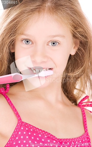 Image of happy girl with toothbrush