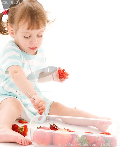 Image of little girl with strawberry