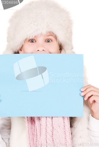 Image of girl in winter hat with blank board