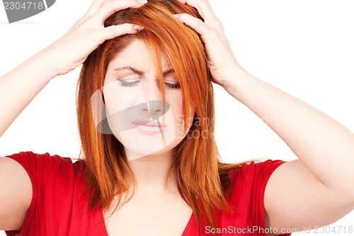 Image of unhappy redhead woman